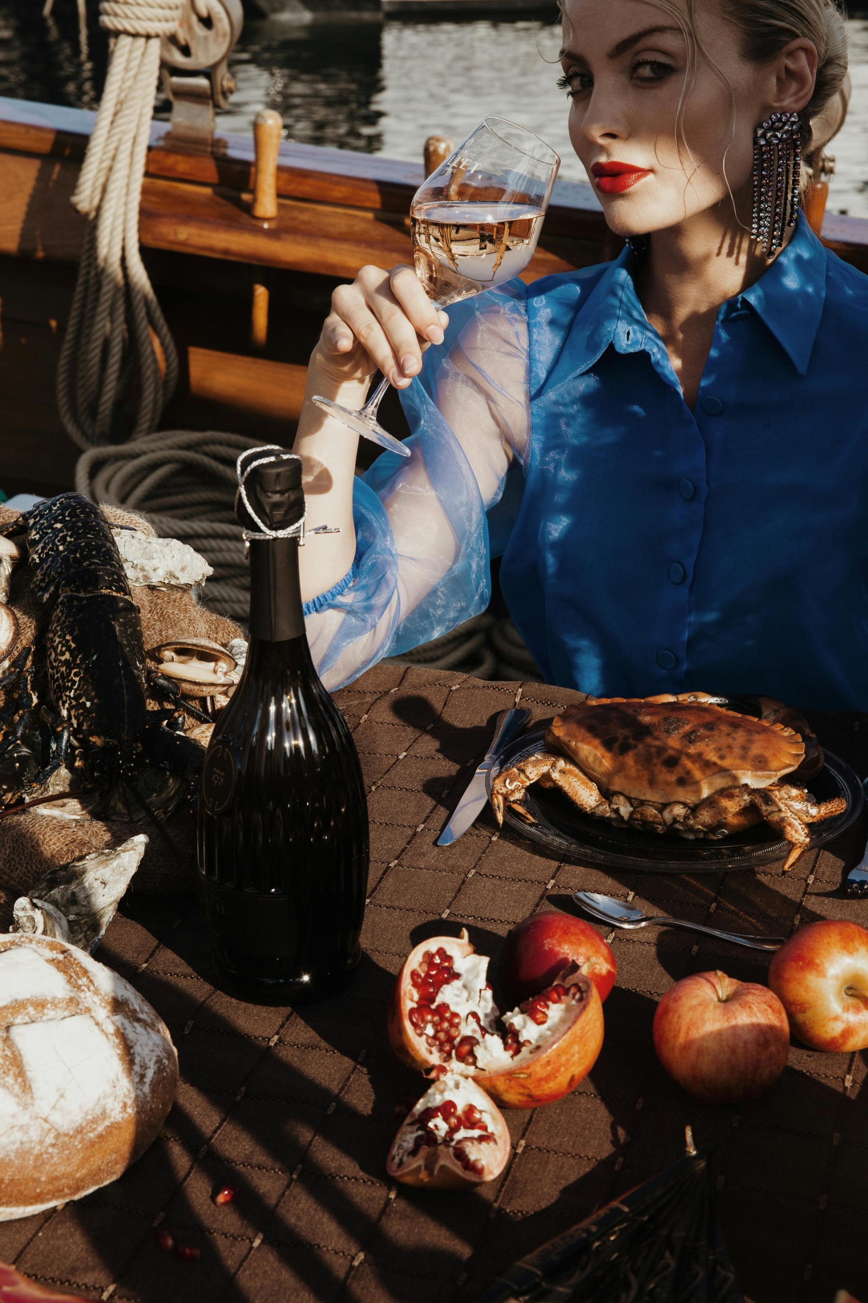 Expensive Wine - Elizaveta Chayko Photo a woman drinking expensive wine on a cafe with pair of foods