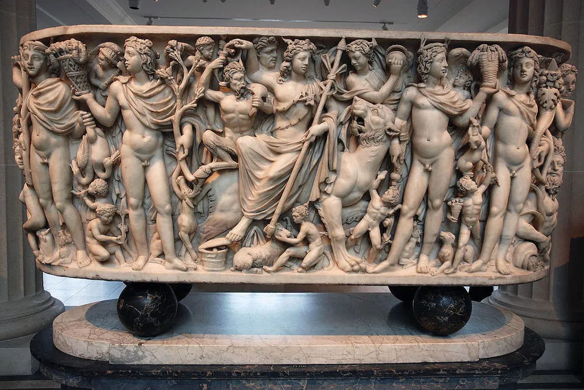 Marble sarcophagus depicting the Triumph of Dionysus and the Seasons, Phrygian marble, Roman, c. 260–270 CE; in the Metropolitan Museum of Art, New York City. The central figure is Dionysus, seated on the back of a panther. In the left foreground are the male figures representing Winter and Spring, and to the right of Dionysus are the male figures representing Summer and Fall. The remaining figures shown are other objects and personages associated with the Bacchic cult. Photograph by Margaret Pierson. The Metropolitan Museum of Art, New York City, purchase, Joseph Pulitzer Bequest, 1955 (55.11.5)